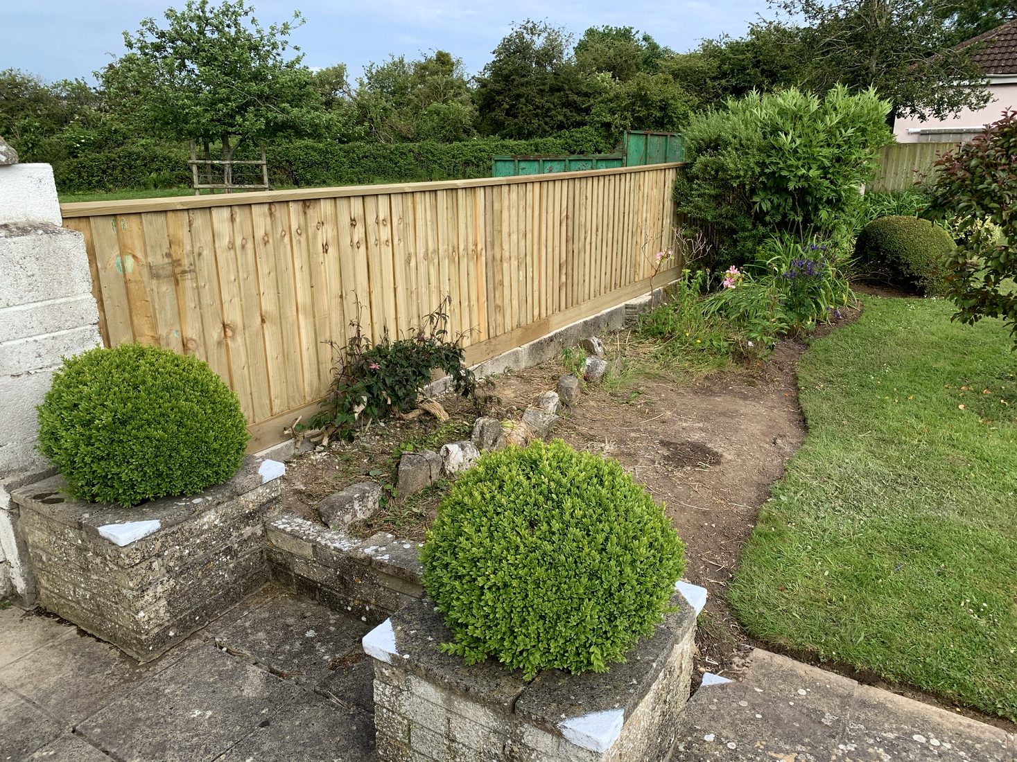 New timber boundary fence installed in a residential garden